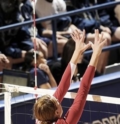 Blocker jumping with forearms above the height of the net