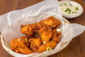 basket of deep-fried chicken wings