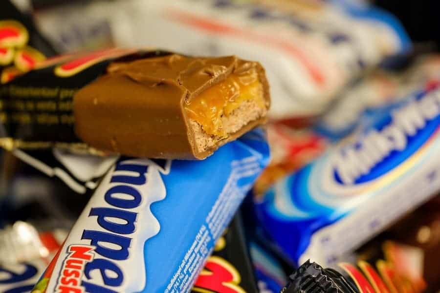 close up of a pile of various types of candy bars