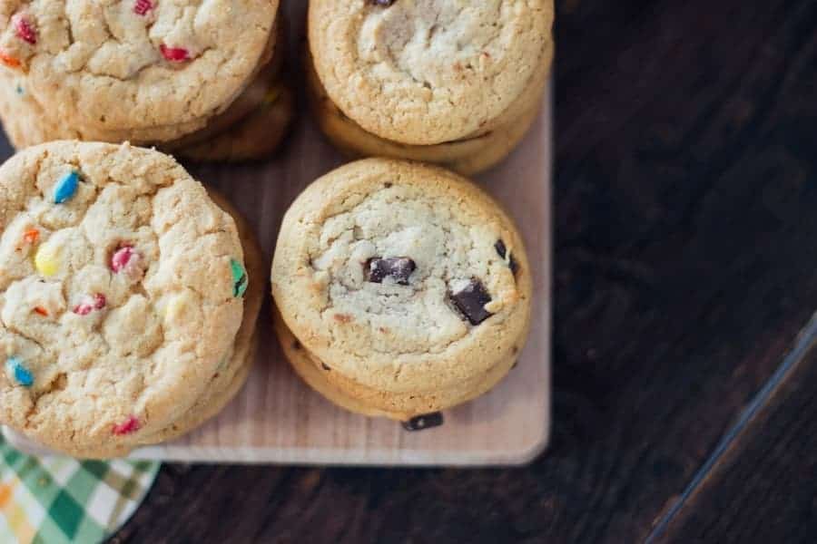 close up of 4 piles of chocolate chip cookies