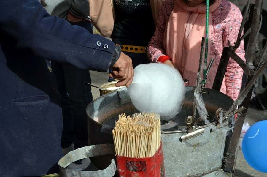 person making cotton candy 