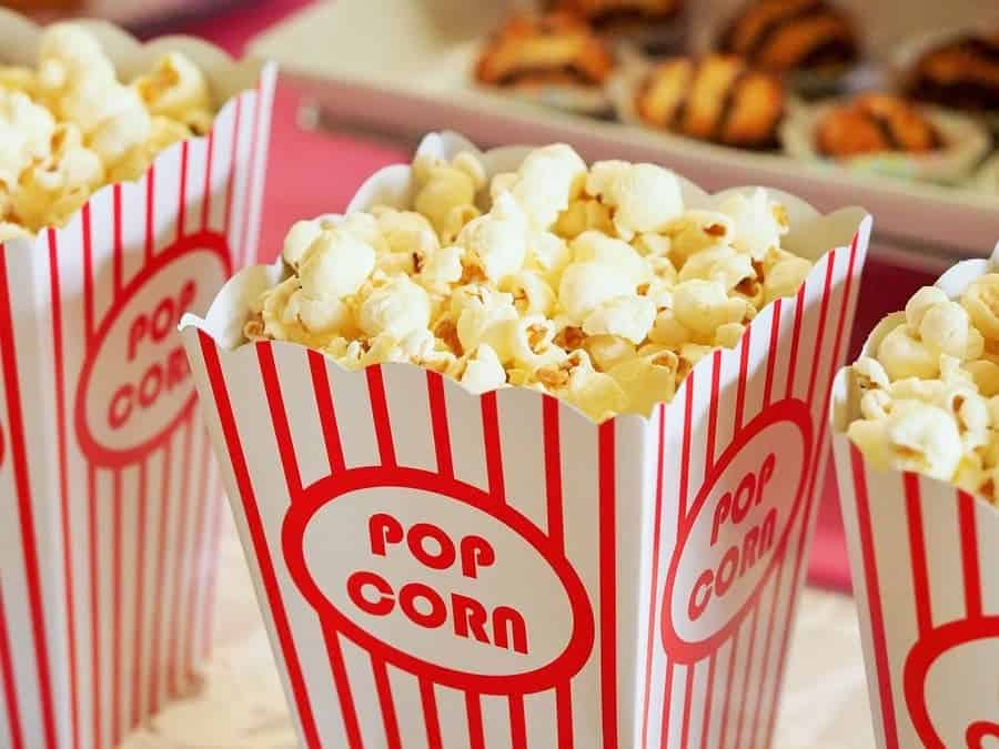 popped popcorn in a striped popcorn box