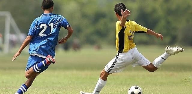 Two soccer players on a field