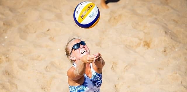Woman bumping a volleyball