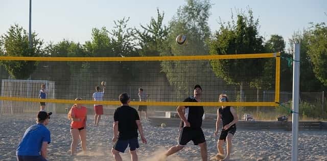 Beach volleyball game being played