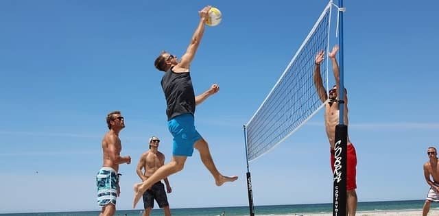 Hitting a beach volleyball 