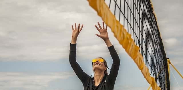 Volleyball player setting the ball