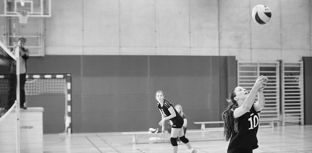 two woman's volleyball players 