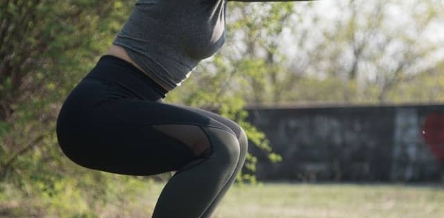 A woman doing squats 