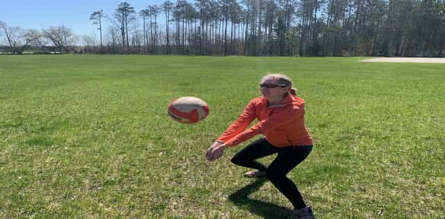 Showing how to bump a volleyball 