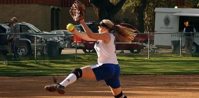 Softball player pitching a ball 