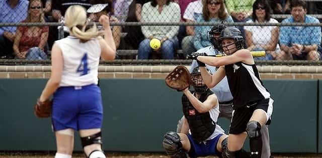 Woman softball pitcher pitching