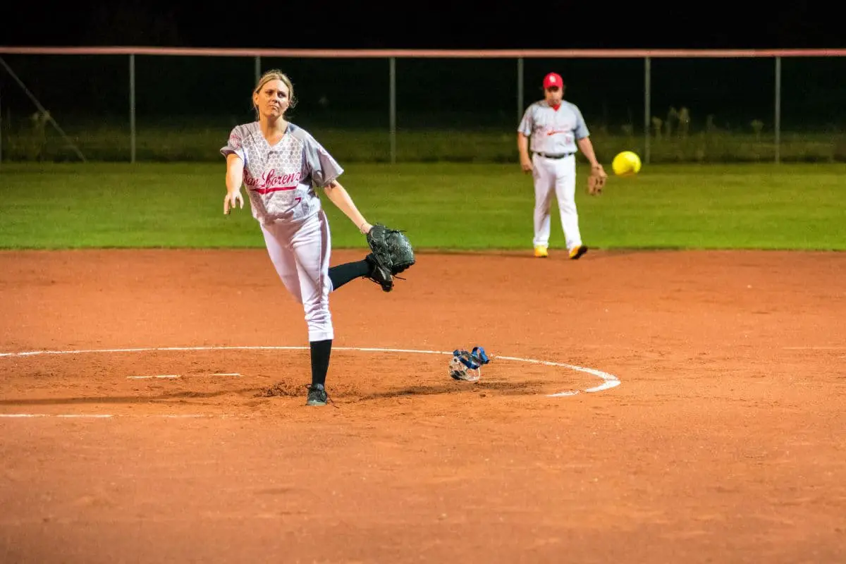 Woman pitching a softball