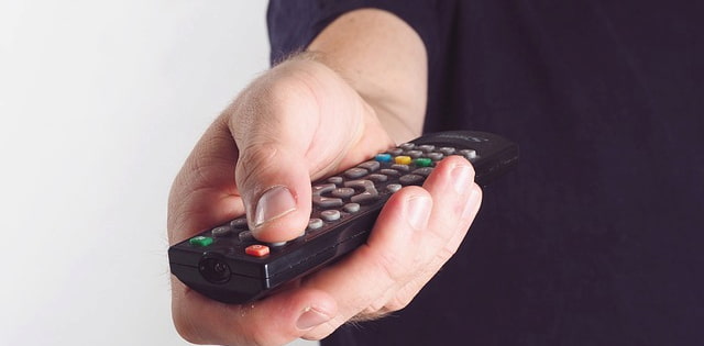 Tv remote in hand